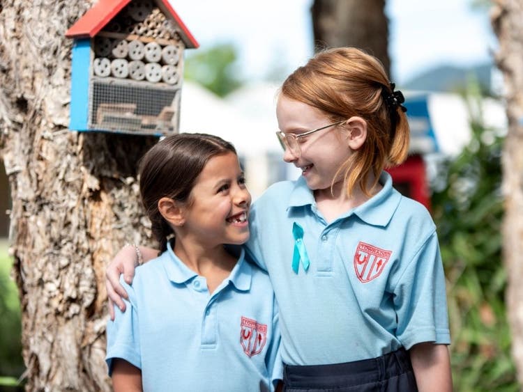 Students smiling at each other