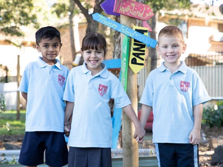 Three students holding hands